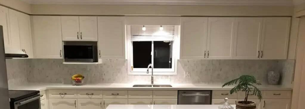 Kitchen island with white cabinetry